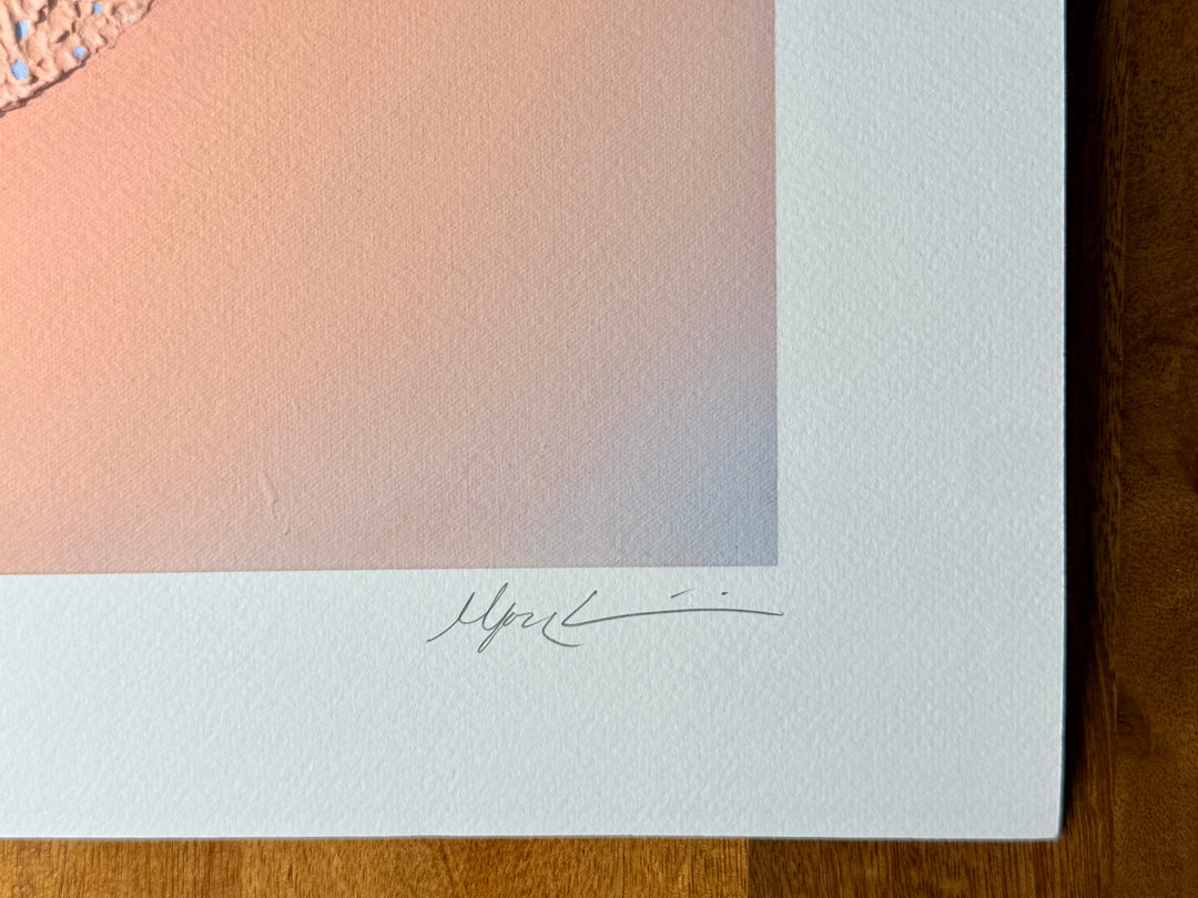 Close-up of the lower corner of the Nuqta print, showing the plaster texture of the original and the pencil signature on the white border